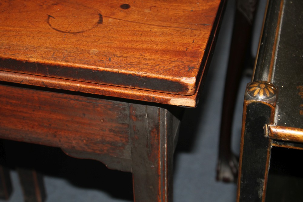 A George III mahogany folding top tea table, with chamfered legs, W.95cm D.45cm H.74cm
